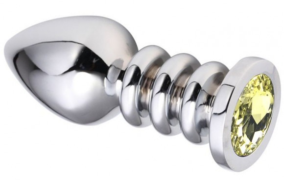 Серебристая анальная пробка на рельефной ножке с желтым кристаллом - 9 см. Серебристая анальная пробка на рельефной ножке с желтым кристаллом - 9 см.