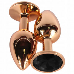 Золотистая анальная пробка с черным кристаллом - 6,8 см.