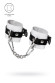 Бело-черные кожаные наручники с одним ремешком с люверсами Бело-черные кожаные наручники с одним ремешком с люверсами